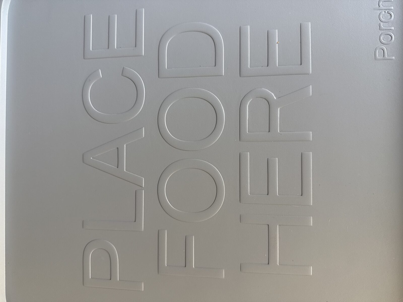 Close-up of PorchDrop's PLACE FOOD HERE embossed tabletop